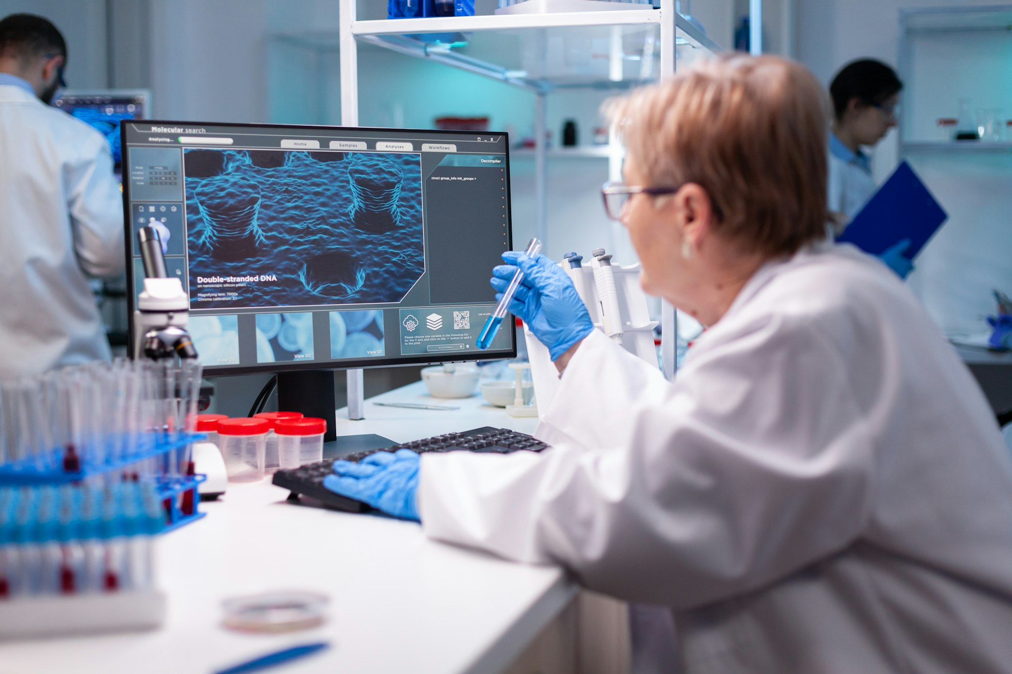 Biotechnologist senior scientist researching with test tube in pharma lab